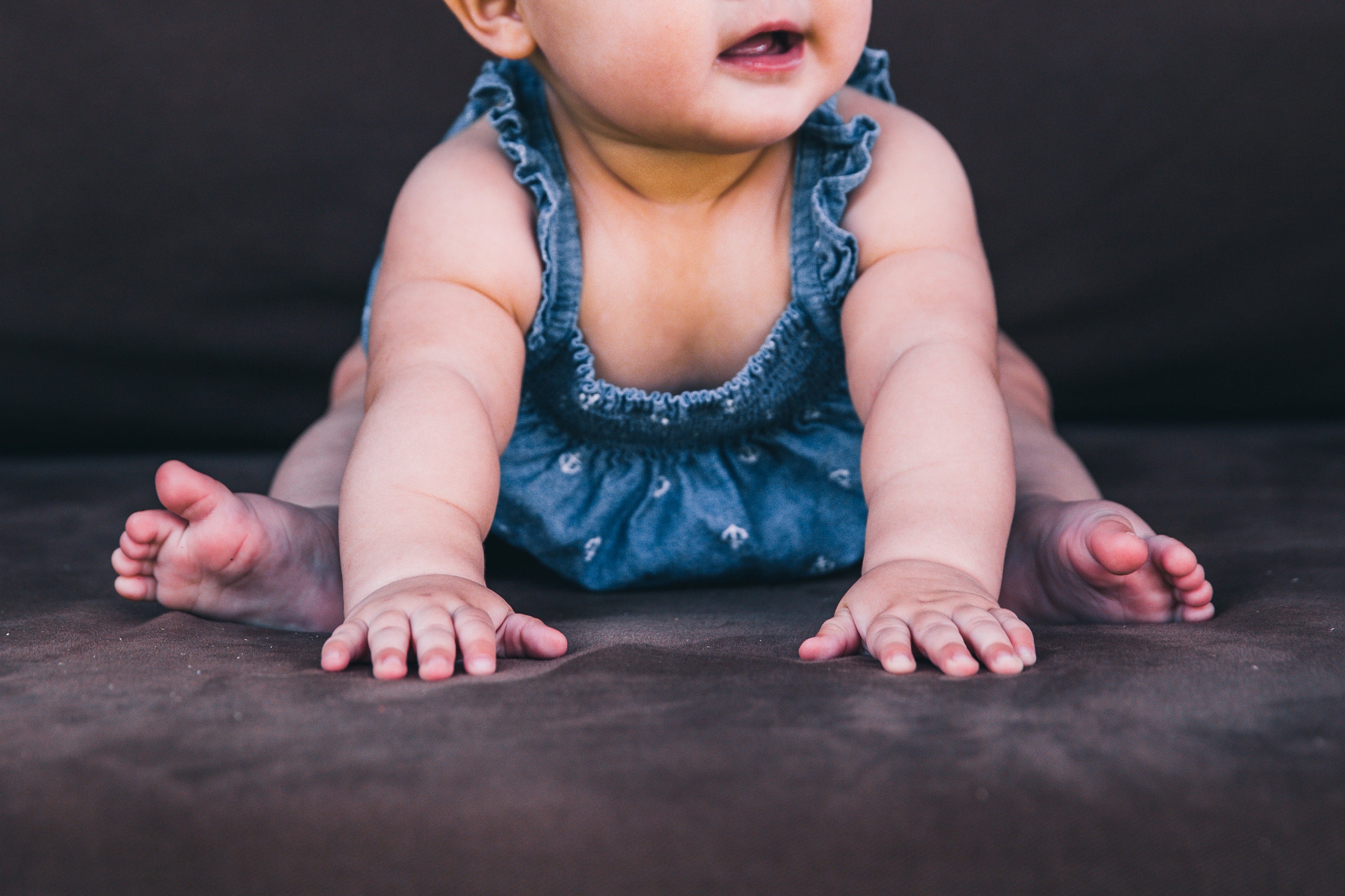 baby in blue dress hands-and-feet